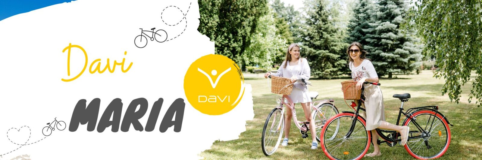 Kaksi naista polkupyörillä puistossa.